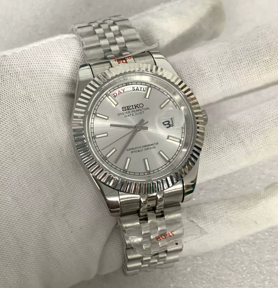 Day-Date Sterling — Fluted bezel, jubilee bracelet, silver sunburst dial