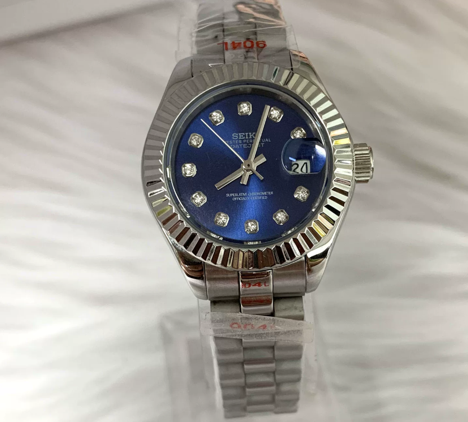 Datejust 28 Sapphire — 28mm case, fluted bezel, royal blue diamond-set dial