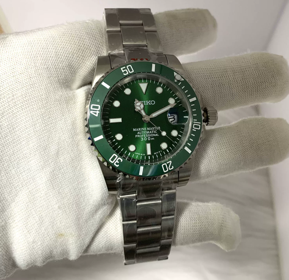 GMT Emerald — Green bezel, emerald sunburst dial