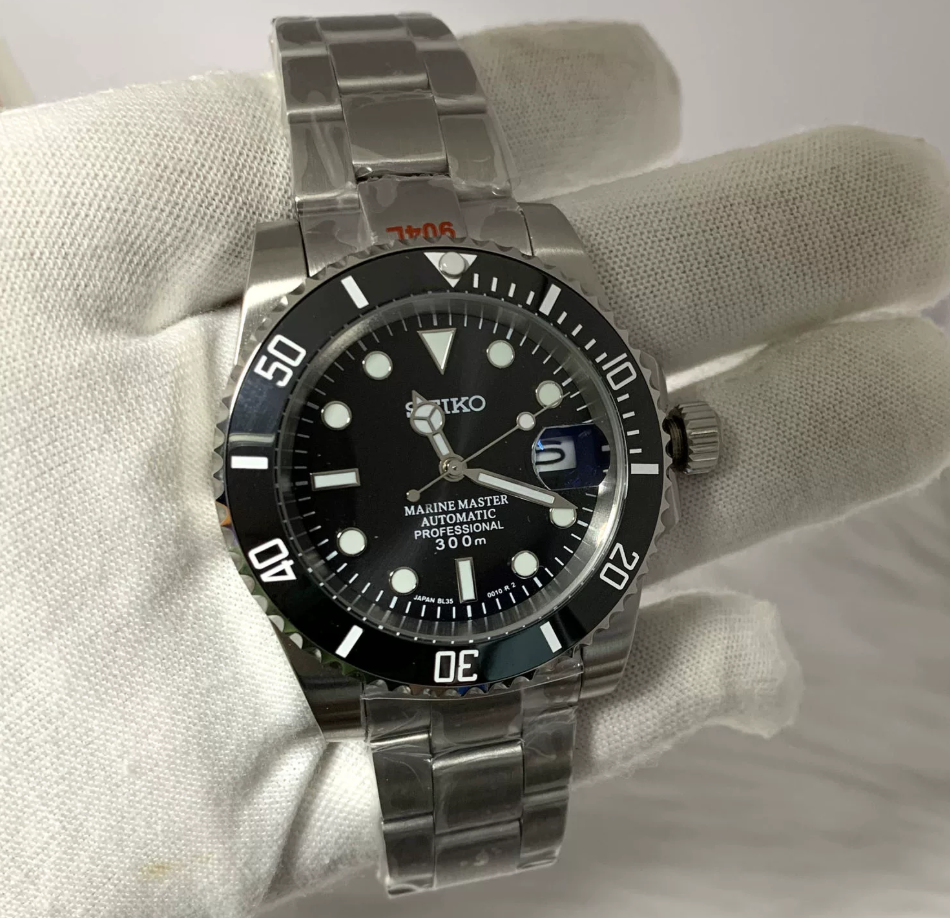 GMT Noir — Black bezel, black sunburst dial