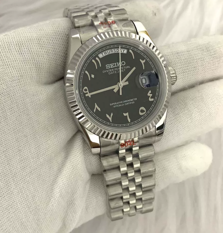 Day-Date Onyx — Fluted bezel, jubilee bracelet, black Arabic dial