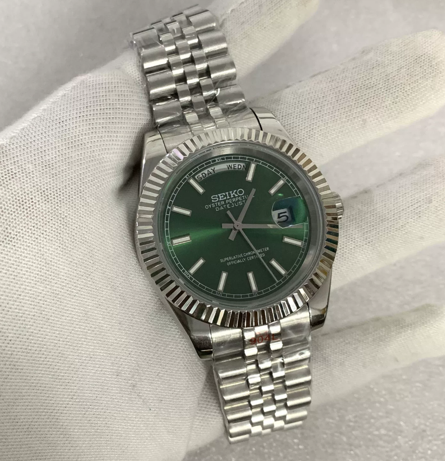 Day-Date Fern — Fluted bezel, jubilee bracelet, sunburst green dial