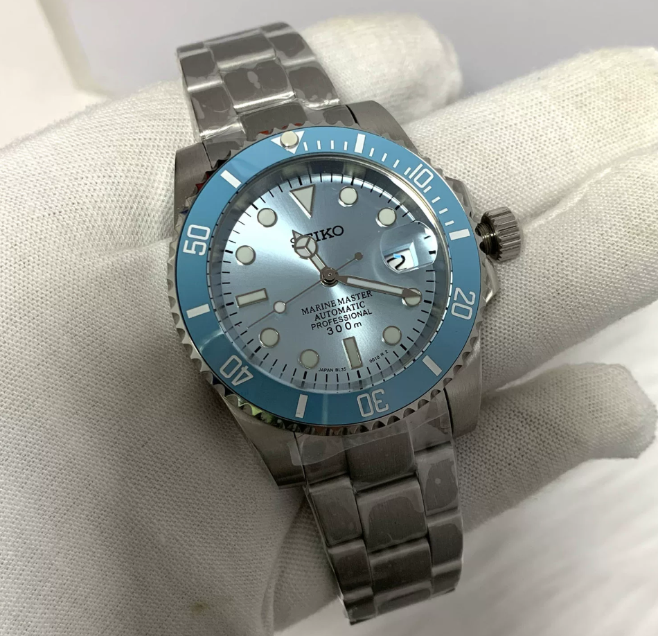 GMT Ice — Ice blue bezel, pale blue sunburst dial