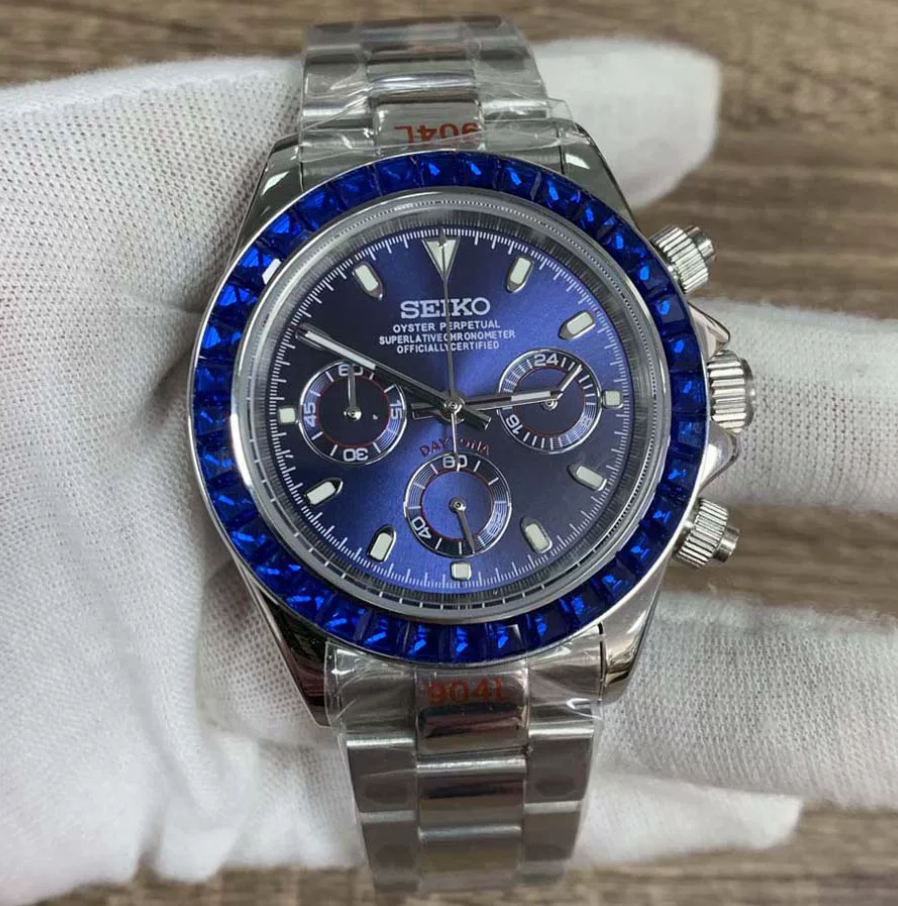 Daytona Sapphire Blue — Blue stone-set bezel, blue sunburst chronograph dial