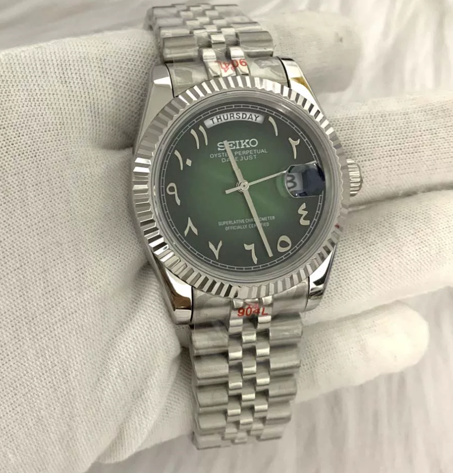 Day-Date Emerald — Fluted bezel, jubilee bracelet, sunburst green dial