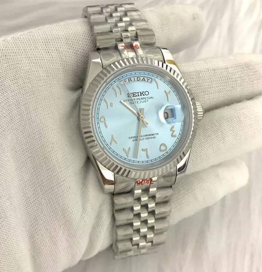 Day-Date Frost — Fluted bezel, jubilee bracelet, ice blue Arabic dial